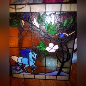 Breathtaking stained glass  hanging window with chain. A beautiful blue unicorn